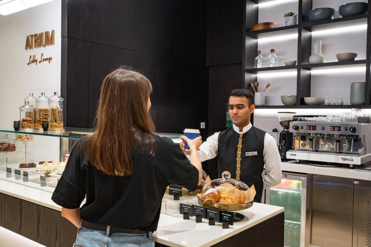 Amwaj Rotana, Jumeirah Beach - Dubai Exterior photo A barista at work